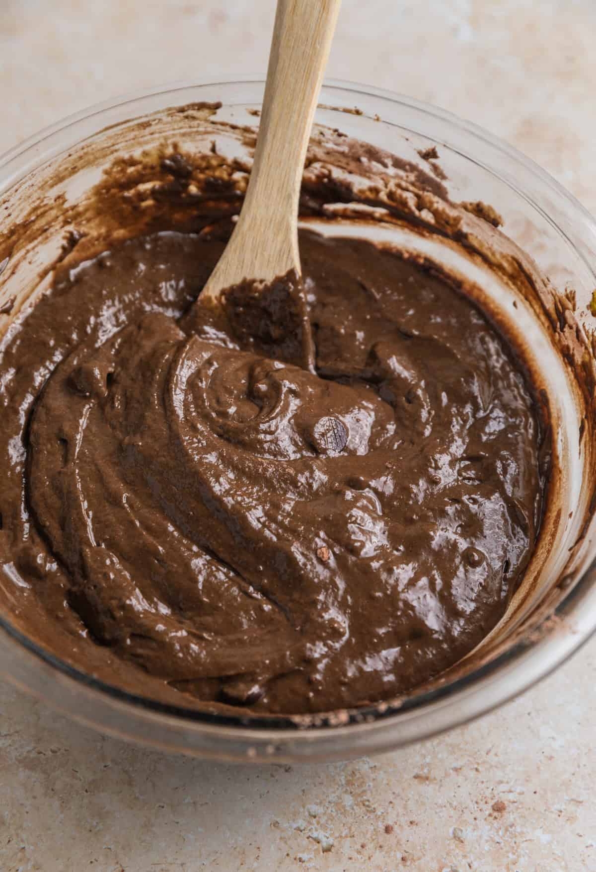 Green smoothie chocolate muffin batter in bowl.
