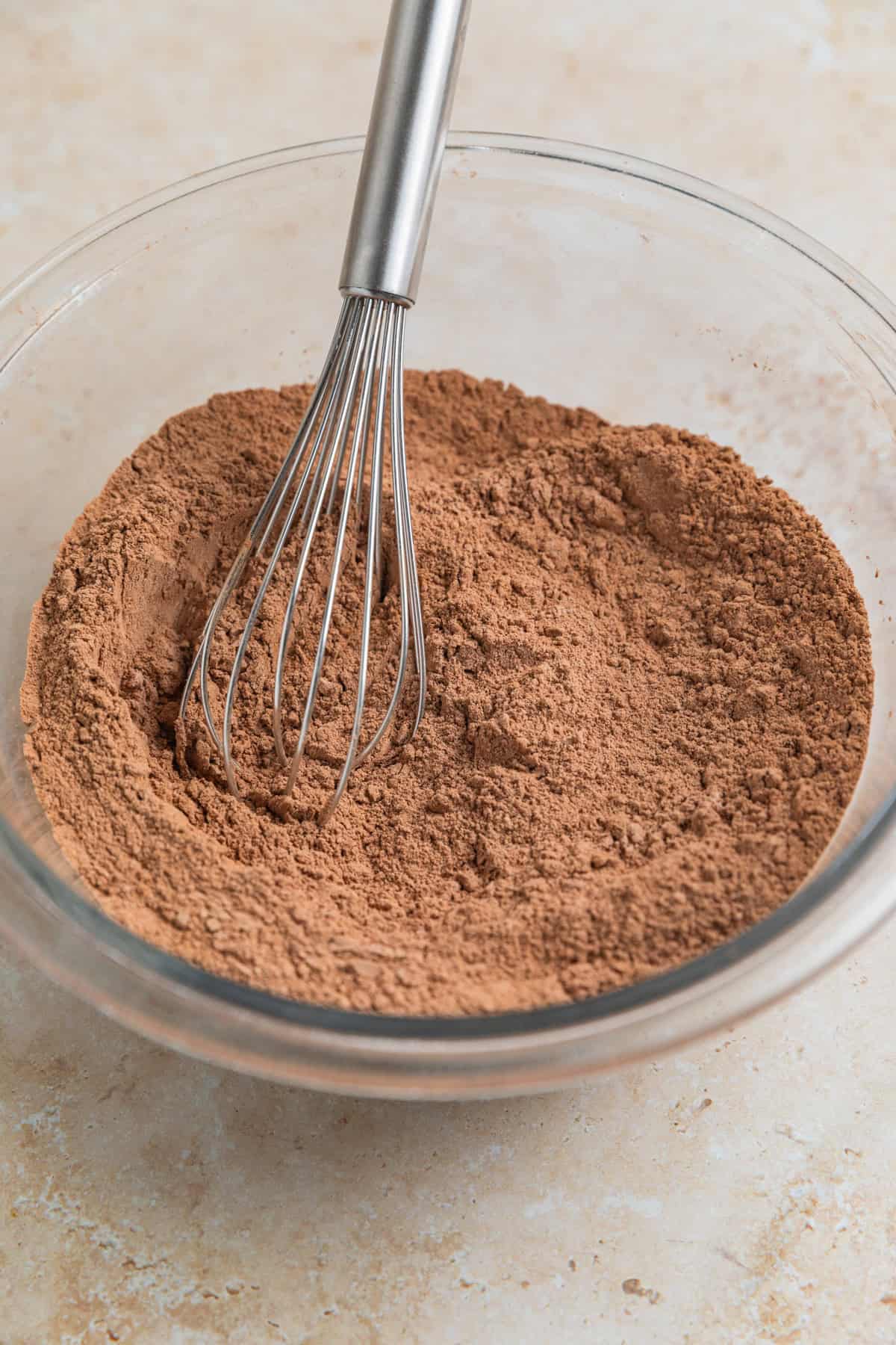 Cocoa powder, flour and other dry ingredients in mixing bowl.