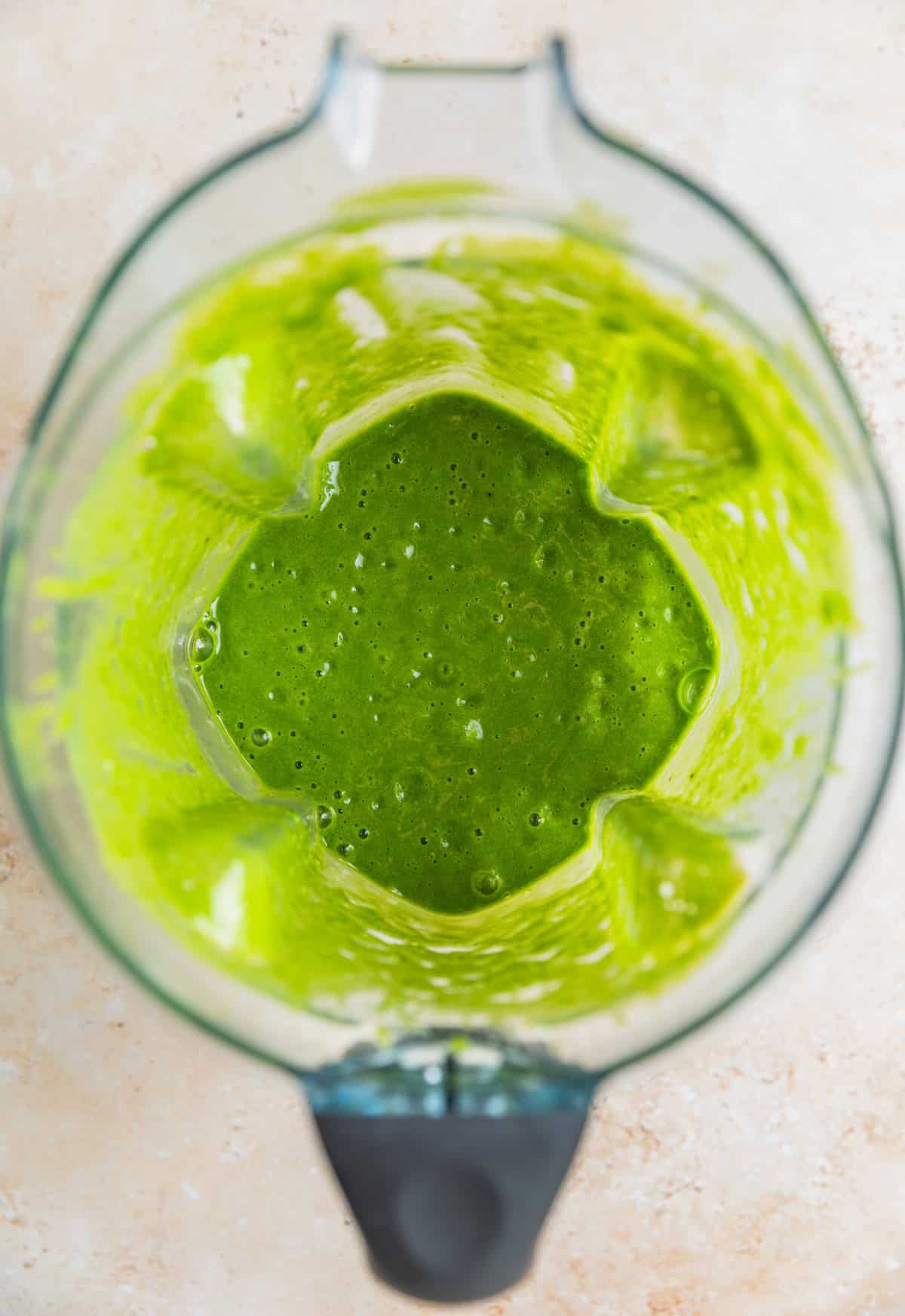 Blended green smoothie ingredients in blender.