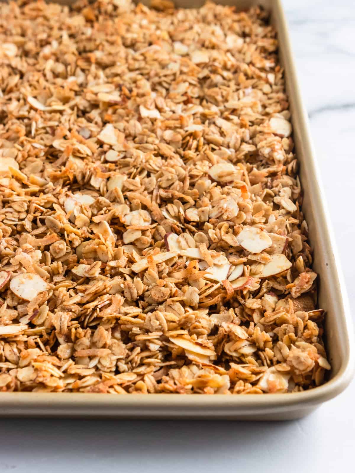 Baking sheet of freshly baked easy granola recipe.