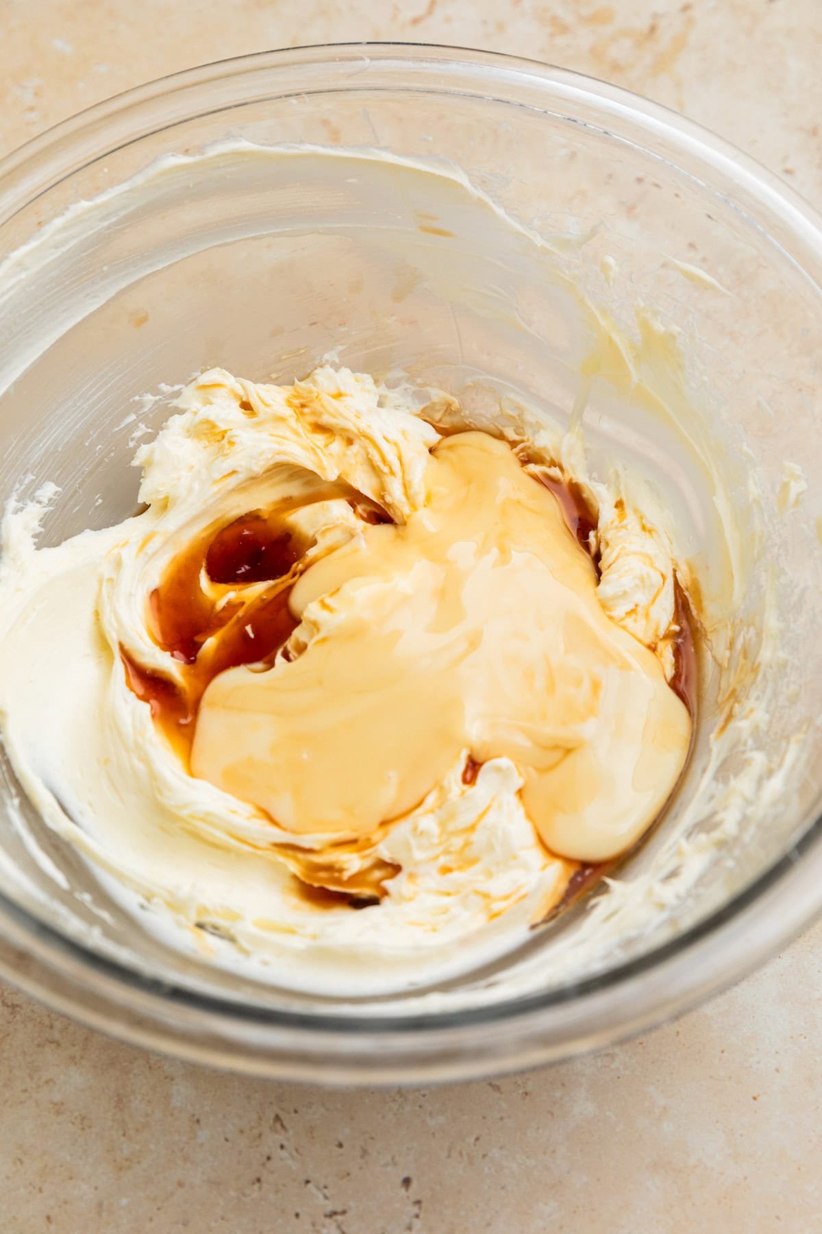 Condensed milk, vanilla and lemon juice added to cream cheese mixture.