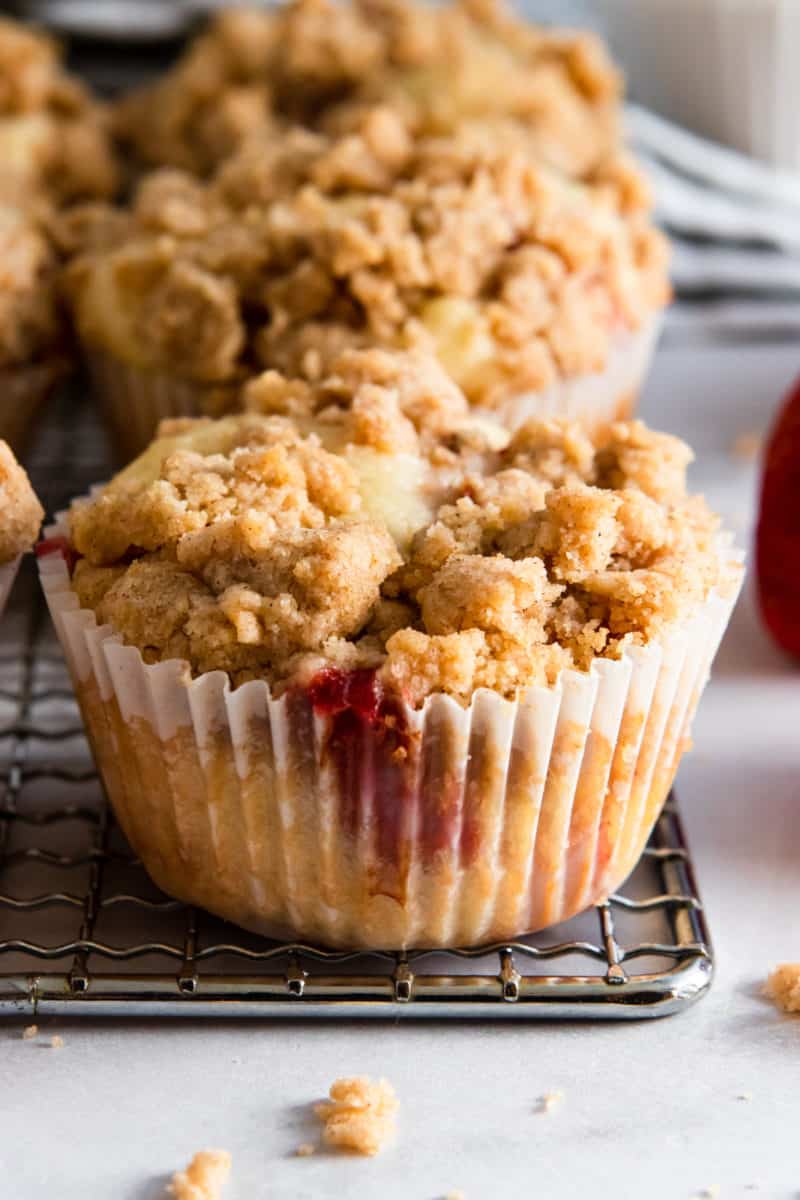 Strawberry Muffin with crumble topping on cooling rack.
