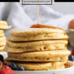 Stack of dairy free pancakes with syrup drizzling on top.
