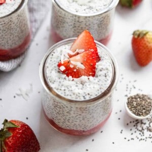 Vanilla Chia Seed Pudding in jar with strawberries.