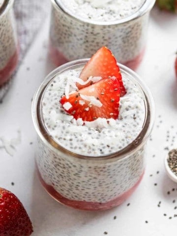 Vanilla Chia Seed Pudding in jar with strawberries.