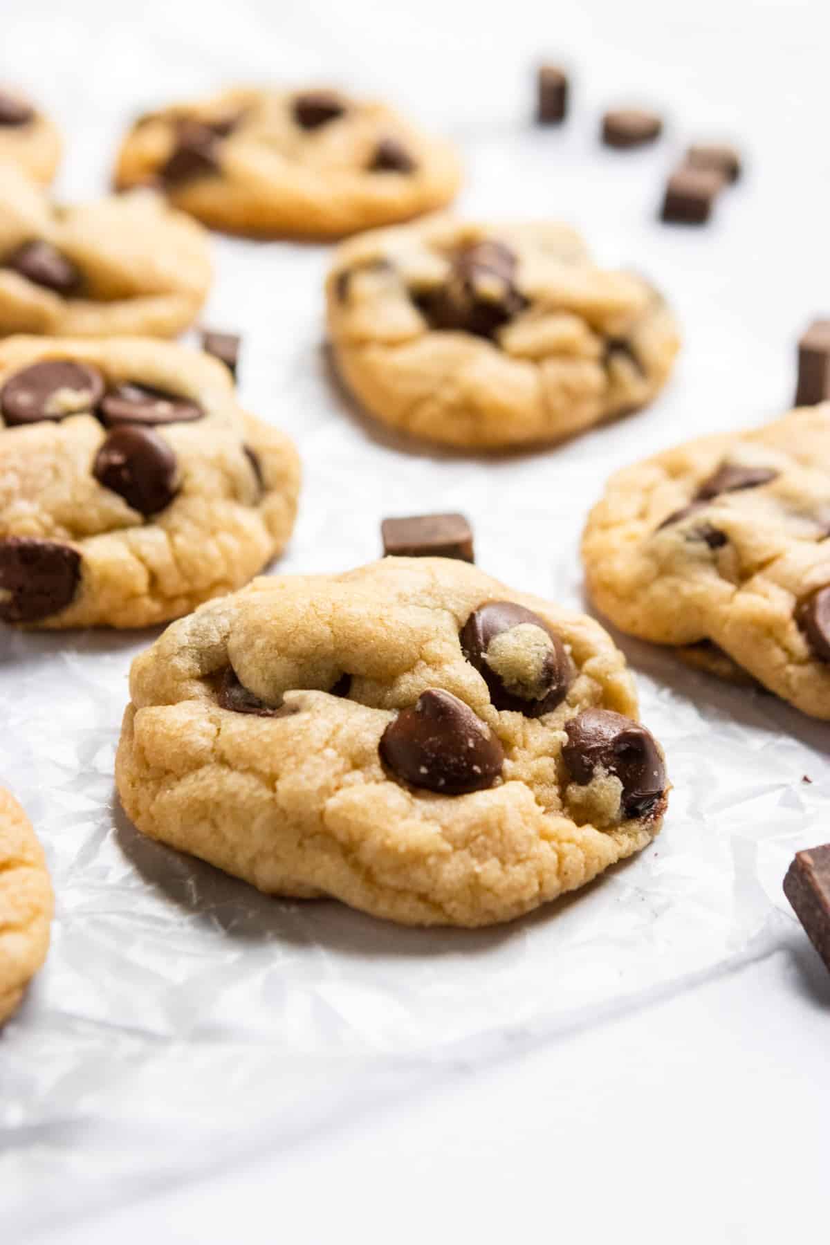 Chocolate chip cookies on parchment.