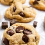 Eggless chocolate chip cookies with cream cheese on wax paper.