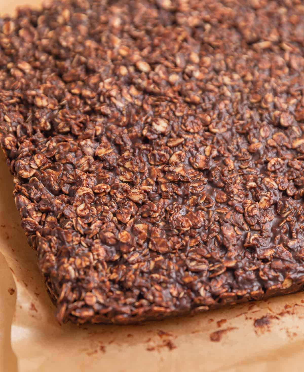 Set peanut butter chocolate oatmeal bars on top of parchment.
