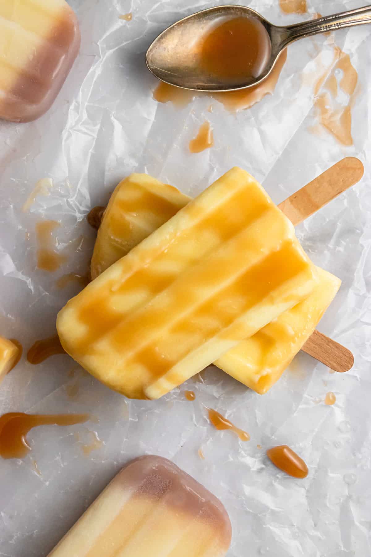Overhead shot of pudding pops with caramel.