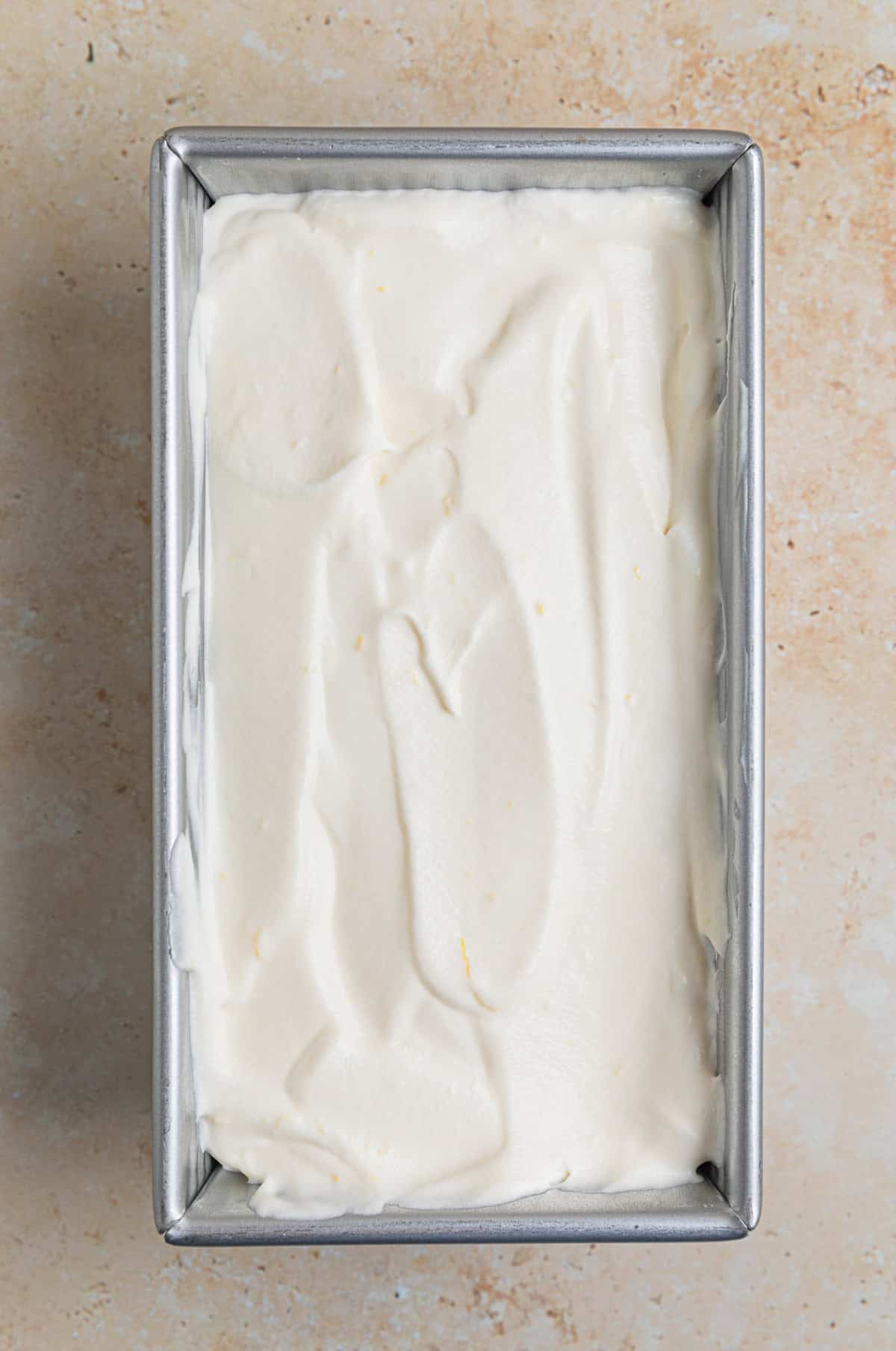 Bread pan with lemon ice cream mixture before freezing.