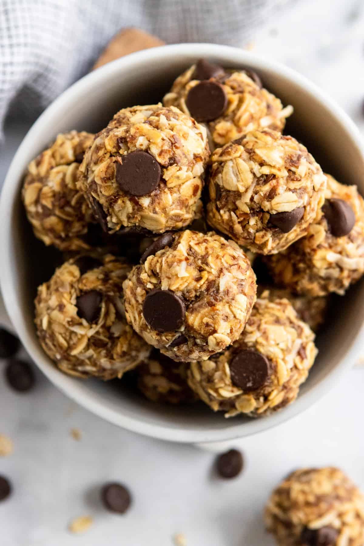 Peanut butter oatmeal balls with chocolate chips in bowl.