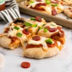 Whole wheat pizza dough baked with toppings.