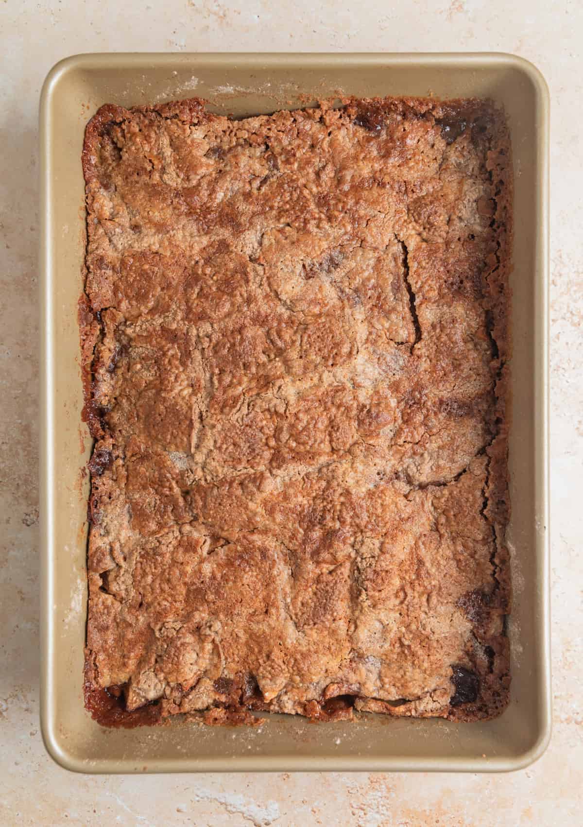 Baked apple dump cake in cake pan.