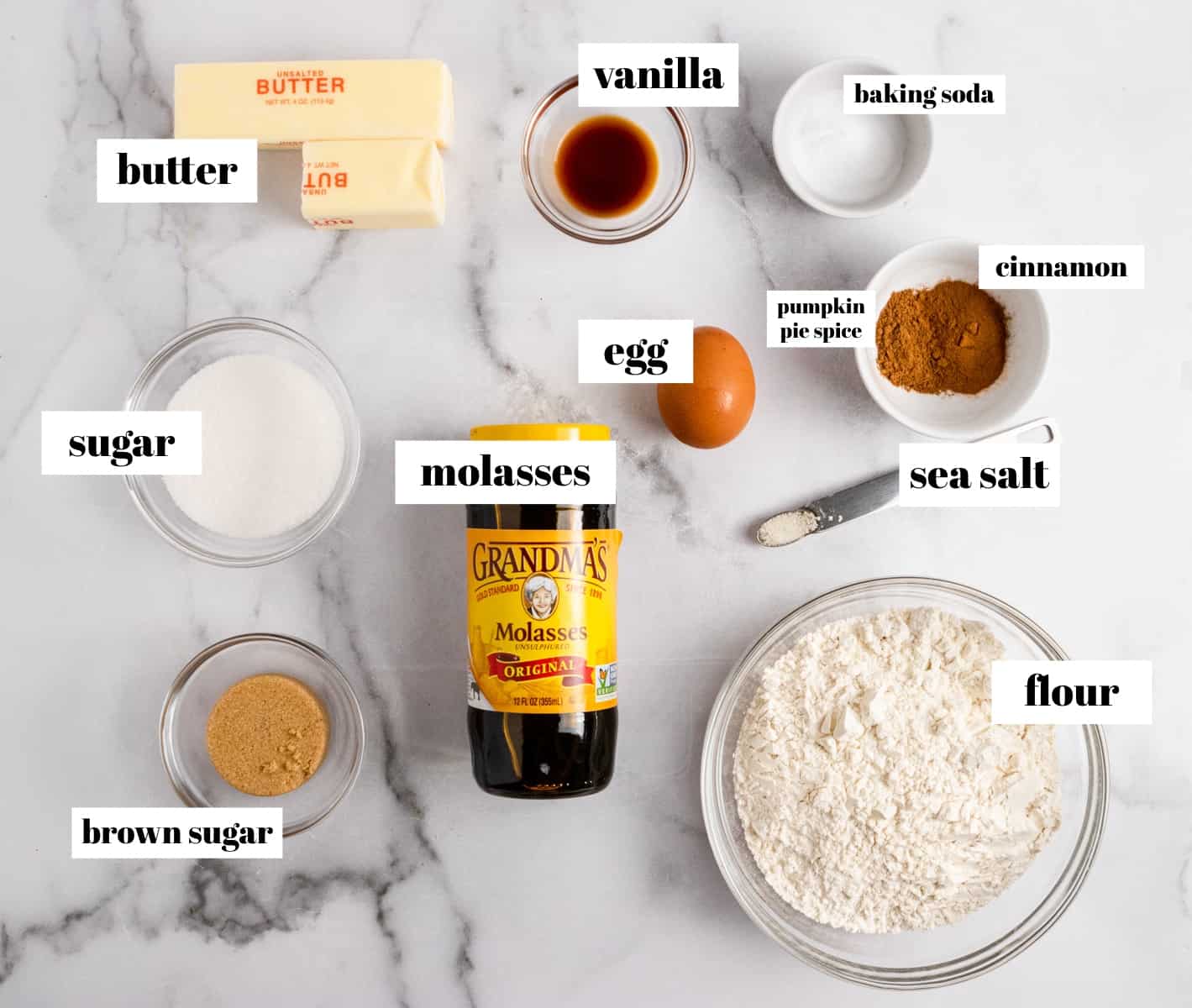 Butter, flour, pumpkin spice, cinnamon, molasses and other ingredients labeled on counter.