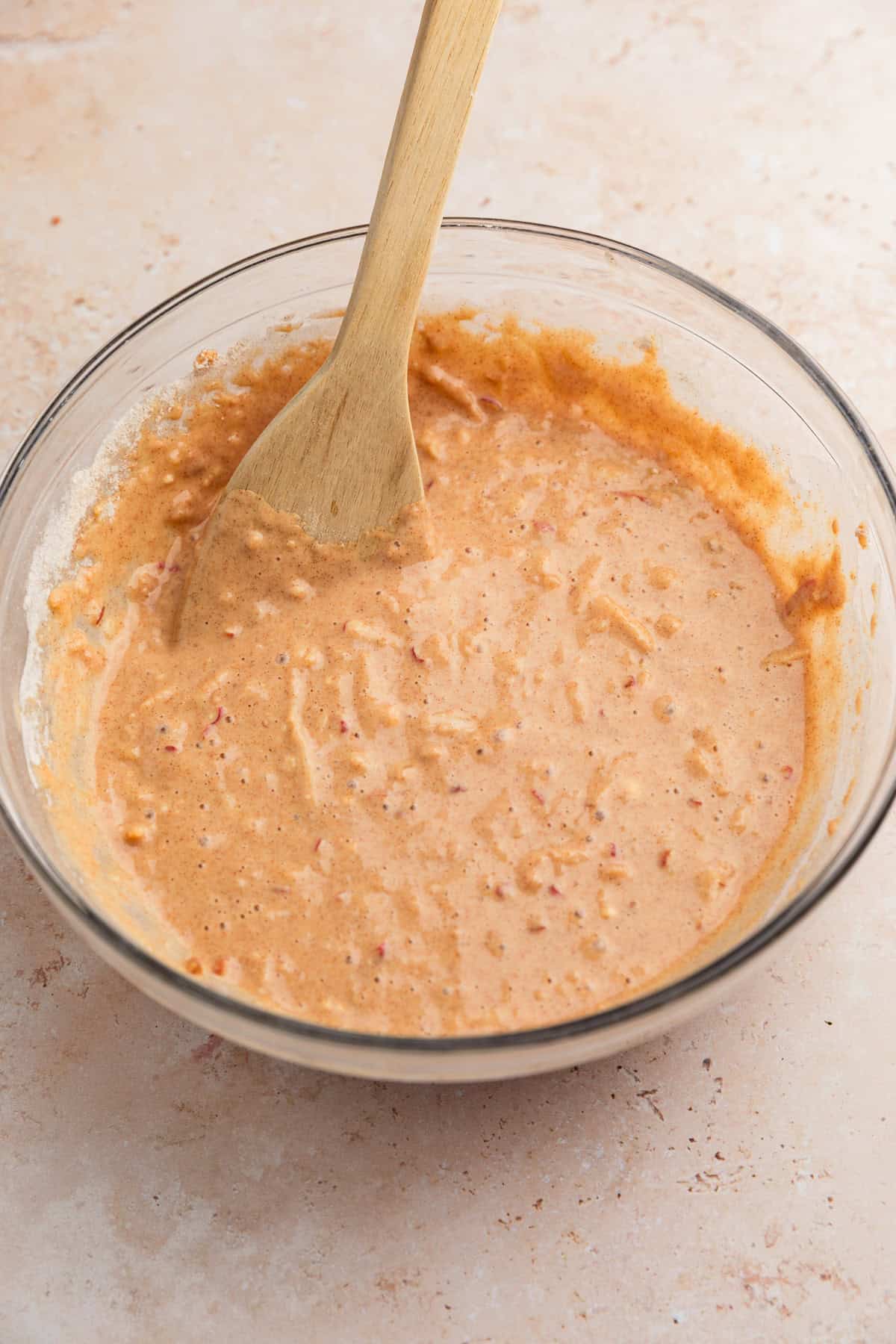 Apple cinnamon donuts batter in bowl.