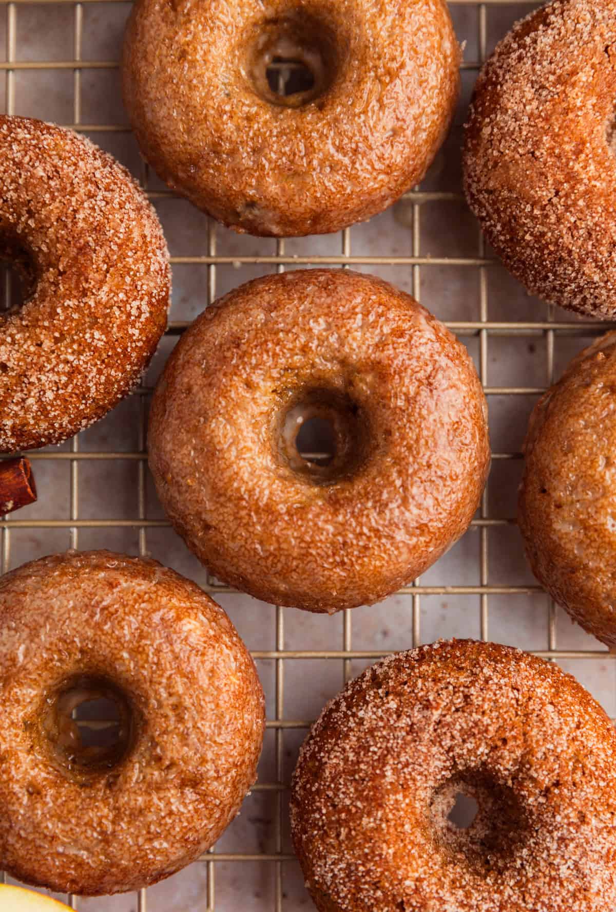 Cooling rack with apple cinnamon donuts with apple cider glaze.