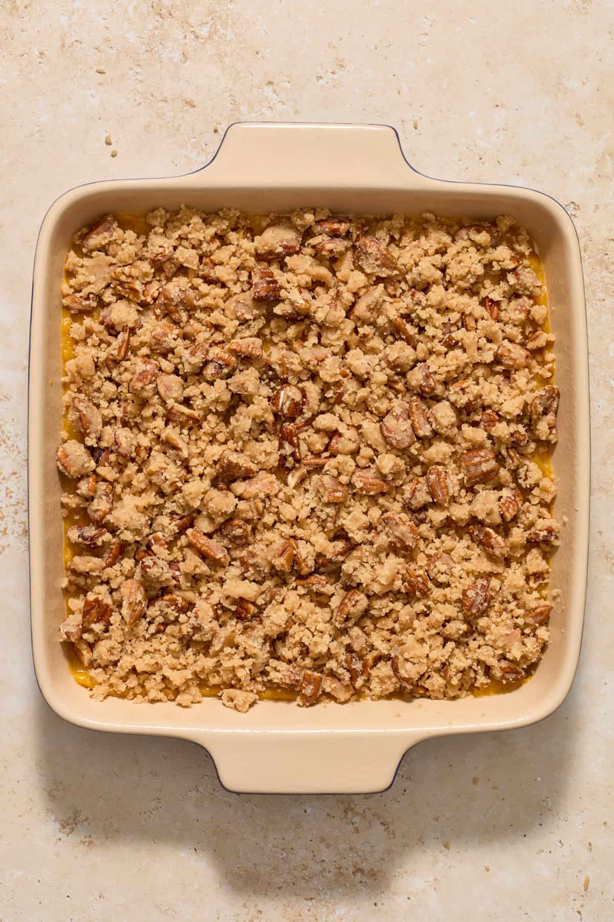 Butternut squash casserole ingredients in baking pan before being baked.