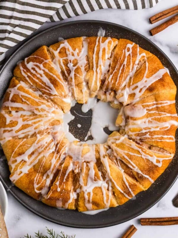 Cinnamon crescent roll wreath with icing drizzle.