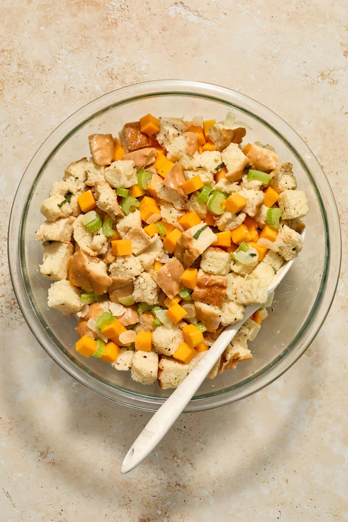 Prepared dressing mixture in glass bowl before being transferred to baking pan.