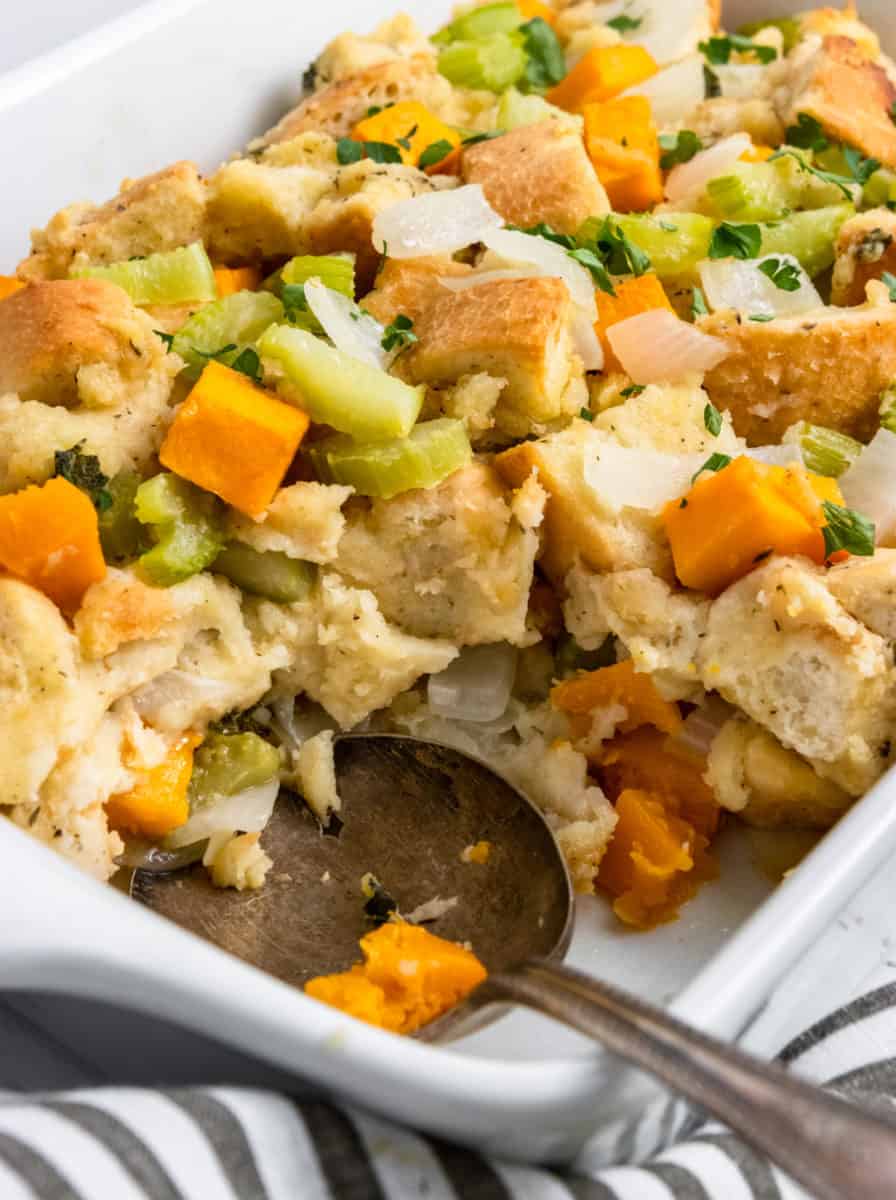 Dish with stuffing scooped out and spoon.