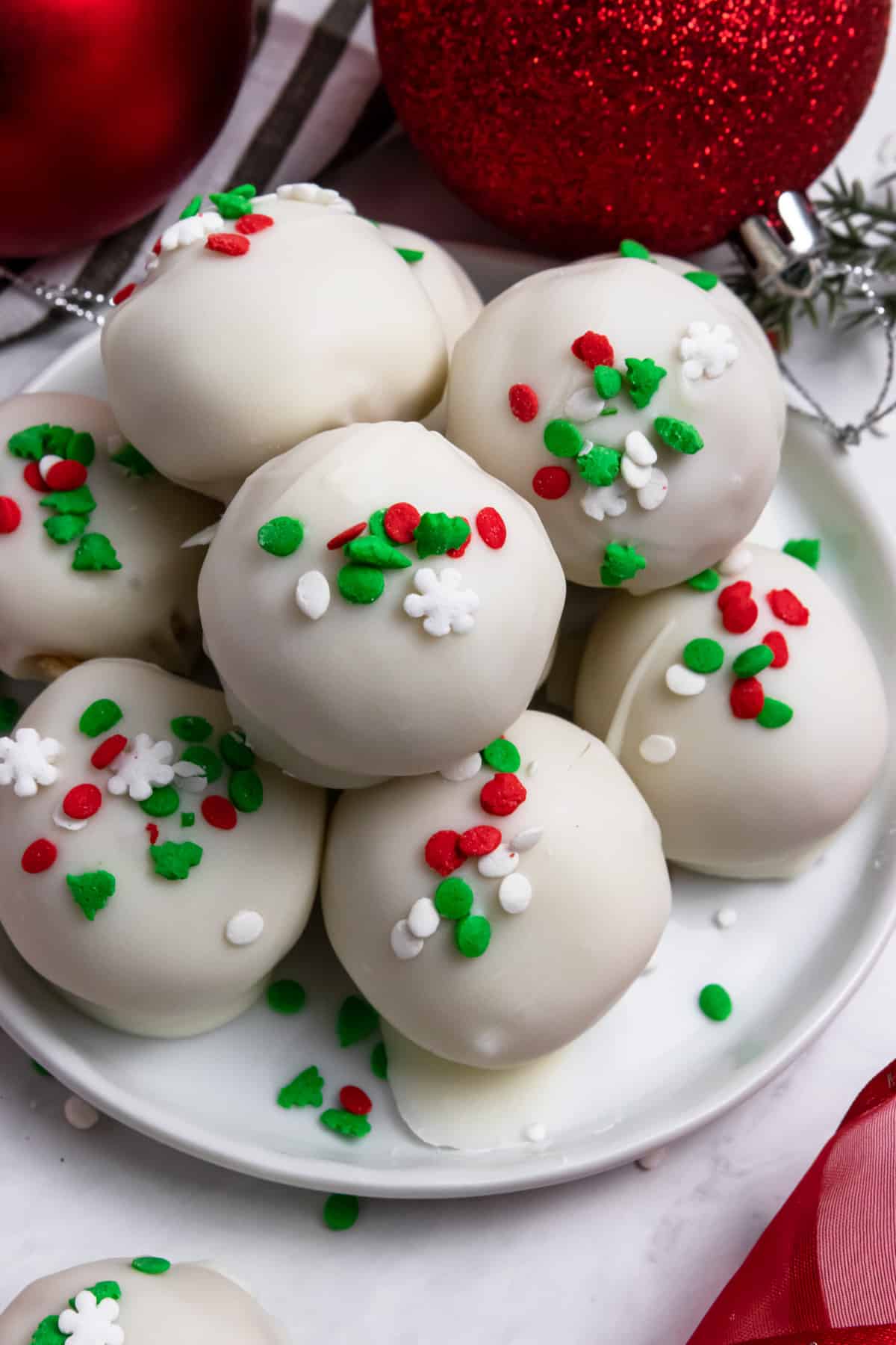 Christmas golden oreo truffles on plate.