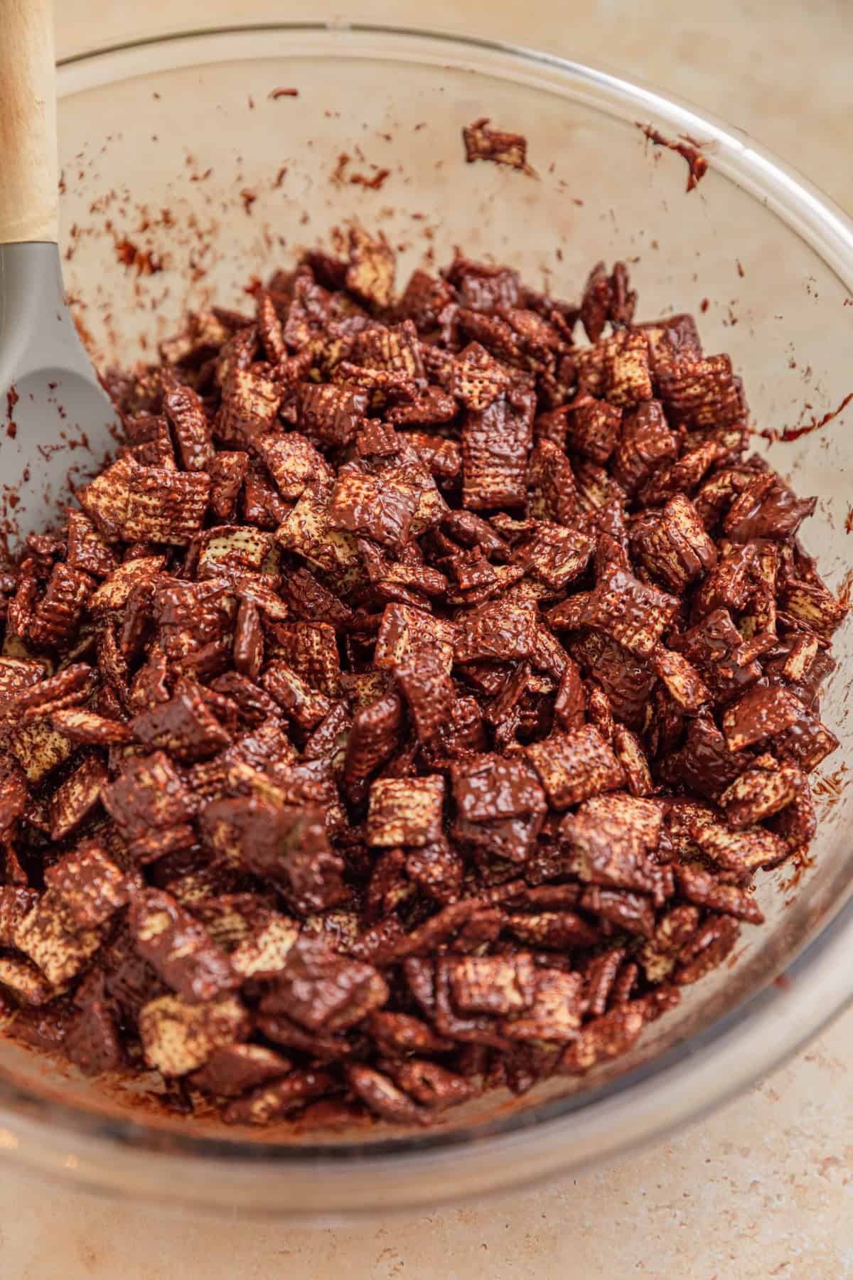 Bowl with dark chocolate coated chex cereal.