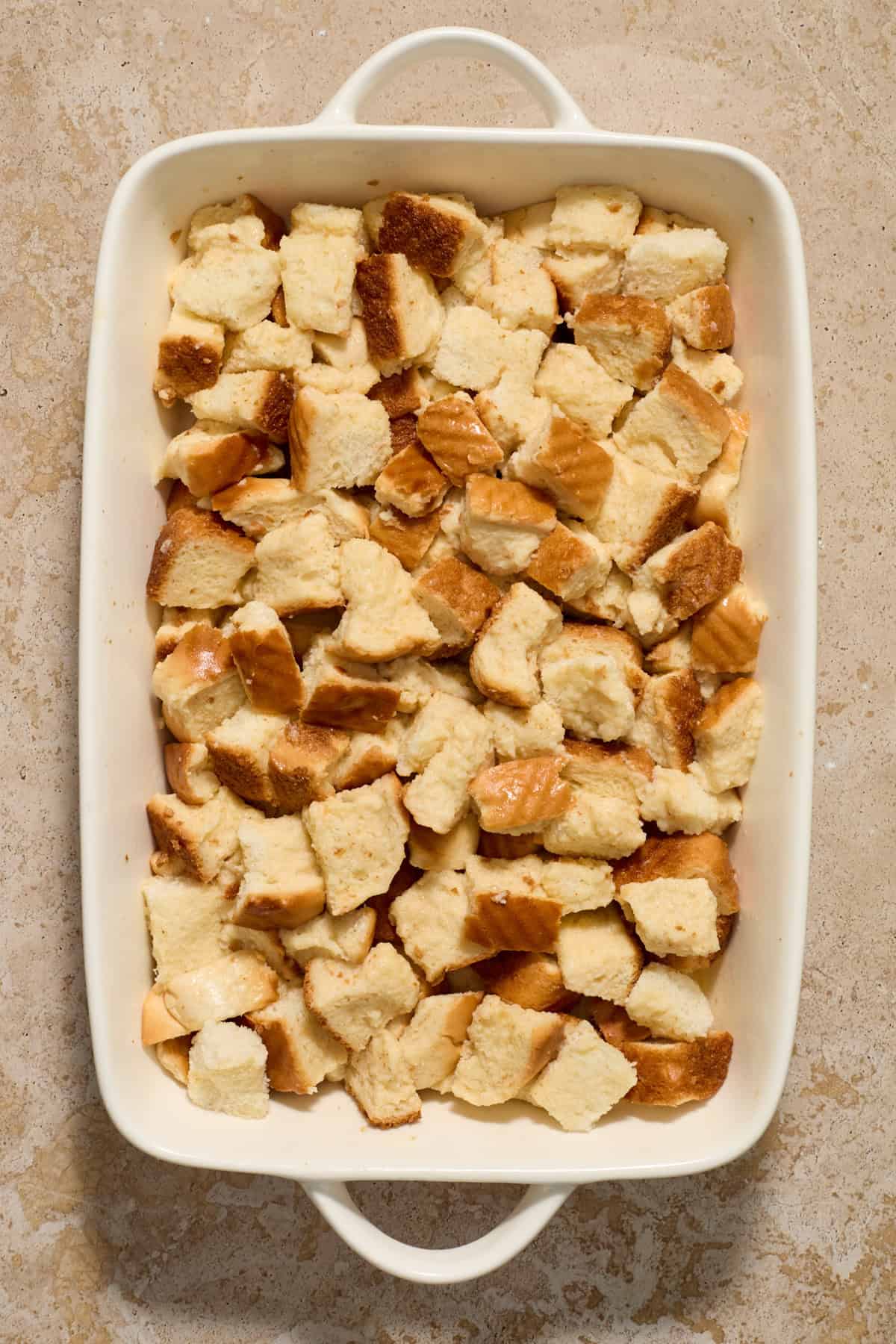 Baking pan with egg soaked bread cubes.