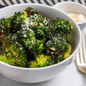 Air Fryer Broccoli in bowl with parmesan on top.