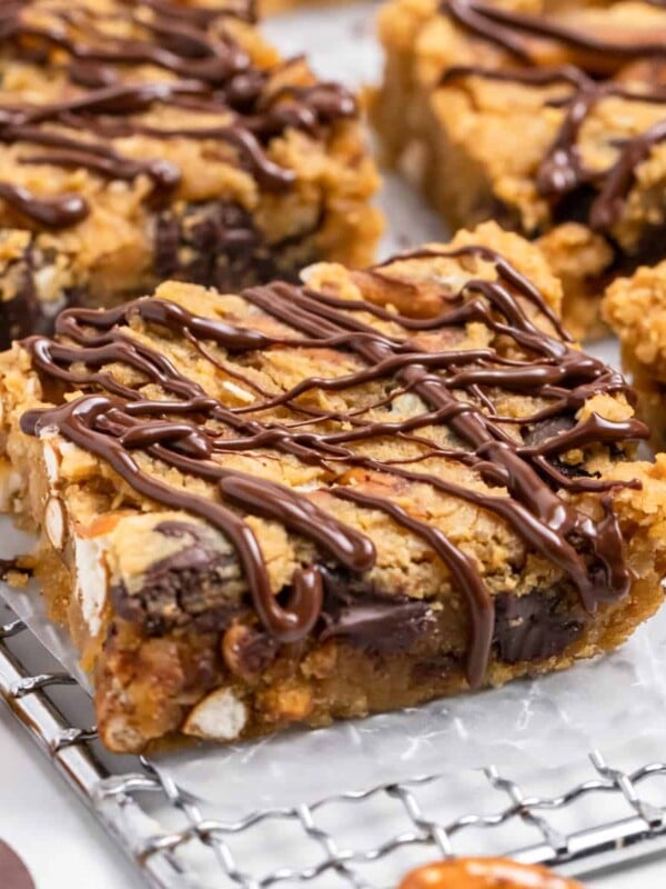 Chickpea blondies on cooling rack with chocolate drizzle.