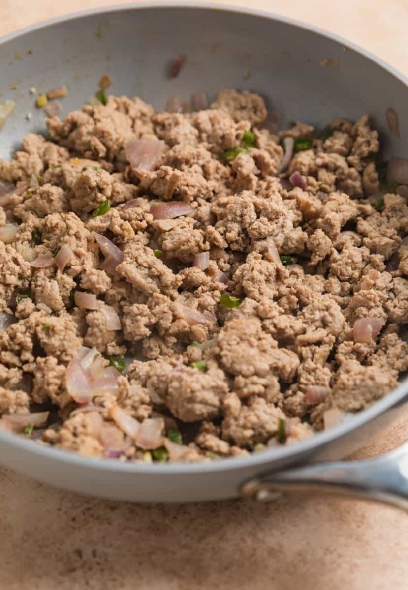 Ground turkey and onions and pepper browned in pan.