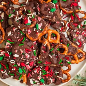 Overhead view of plate with dark chocolate candy cane pretzel bark.