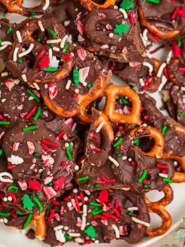 Overhead view of plate with dark chocolate candy cane pretzel bark.