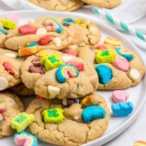 Lucky Charm Cookies on white plate with marshmallows.