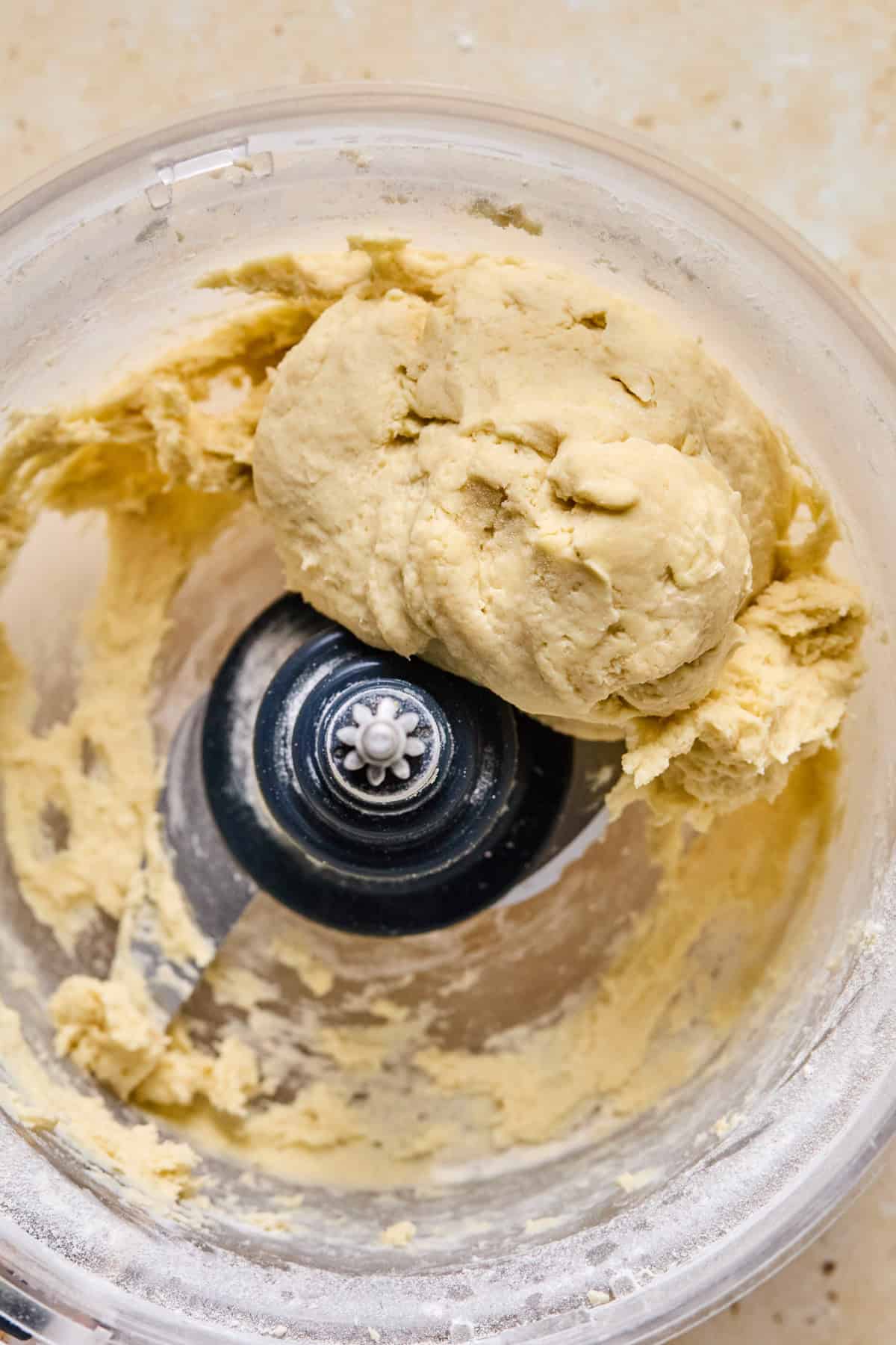 Ball of pie crust in food processor.