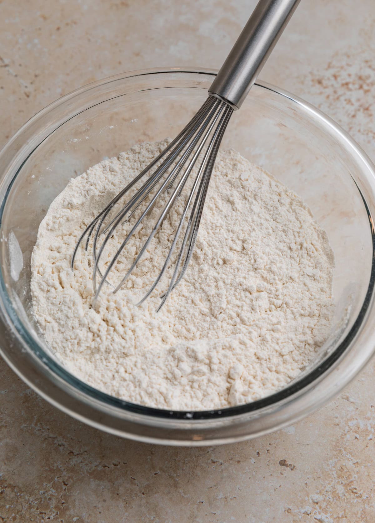 Whisk in bowl with flour and dry ingredients for recipe.