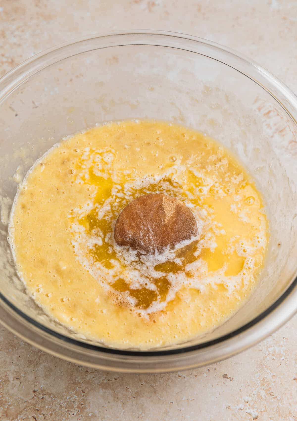 Brown sugar, butter and vanilla added to mashed banana in bowl.