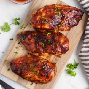 Overhead view of Air Fryer BBQ Chicken on cutting board.