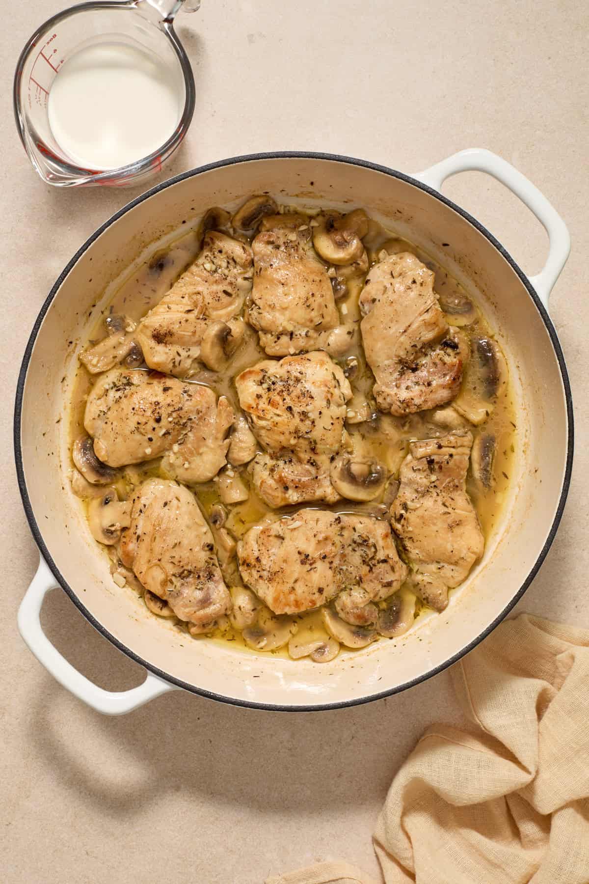 White wine added to skillet with chicken and mushrooms.