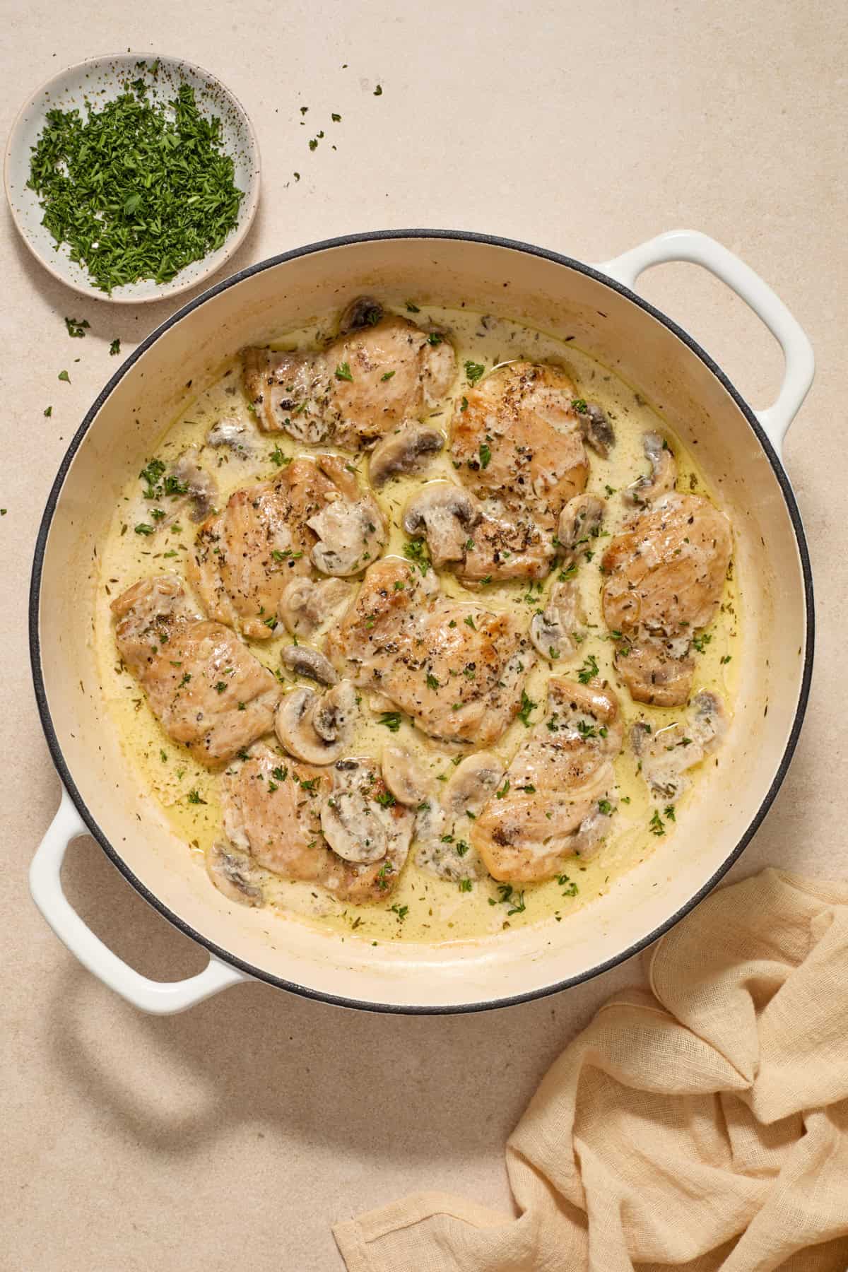 Parsley sprinkled over top of chicken and cream of mushroom sauce.