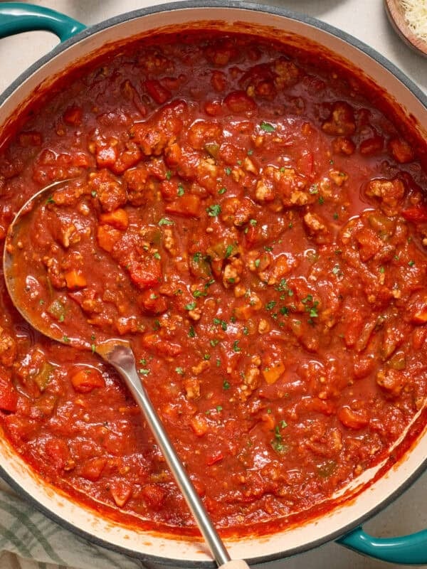 Ground turkey spaghetti sauce in pot with ladle.