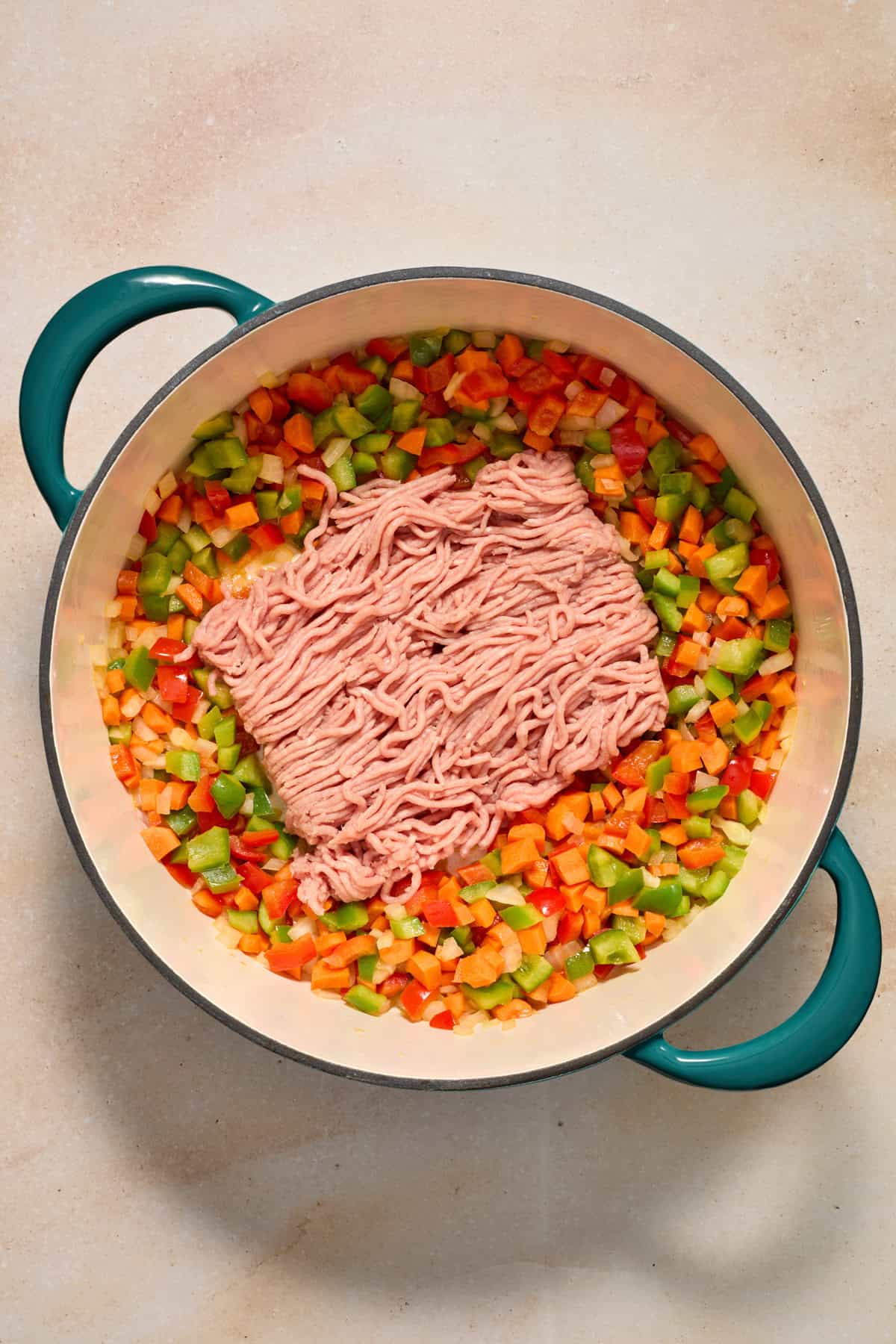 Ground turkey added to pot with sautéed vegetables.