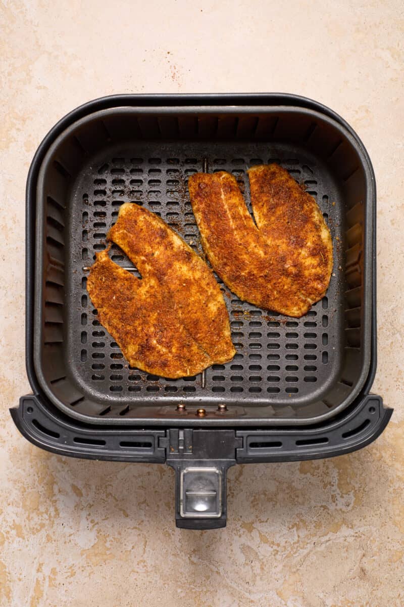 Tilapia in air fryer after cooking.