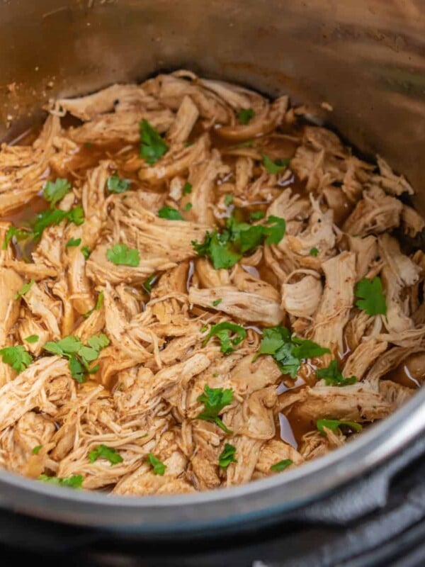 Shredded chicken with cilantro in Instant Pot.