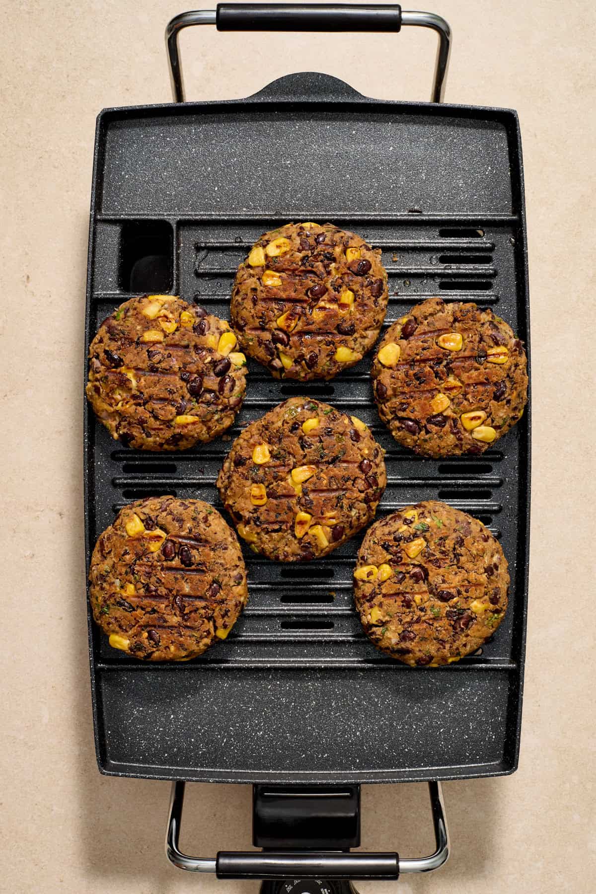 Grilled black bean burgers on grill.