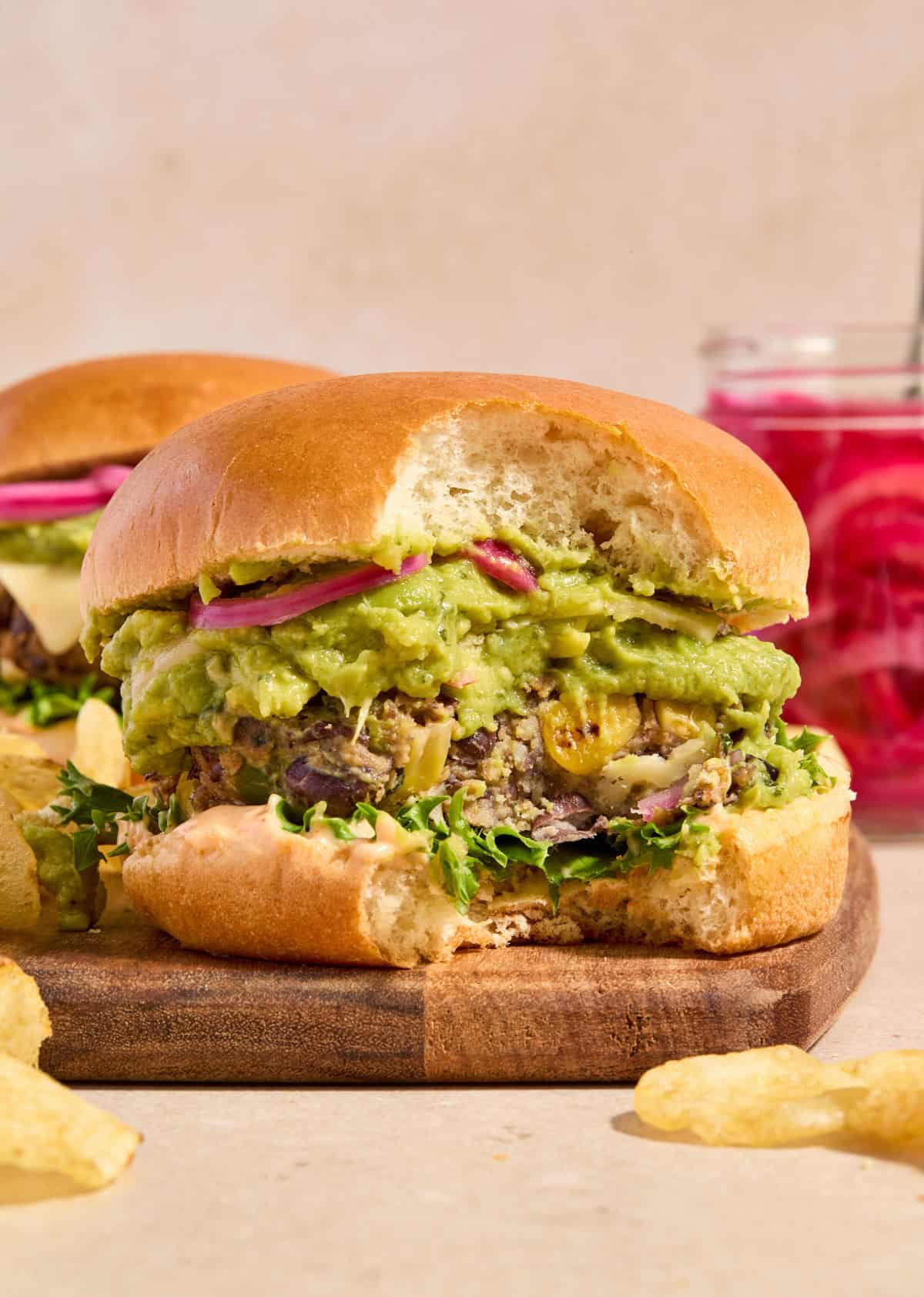 Spicy black bean burger with bite taken out.