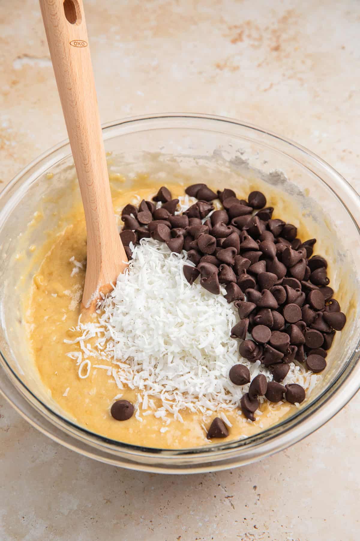 Banana bread batter with coconut and chocolate chips added.