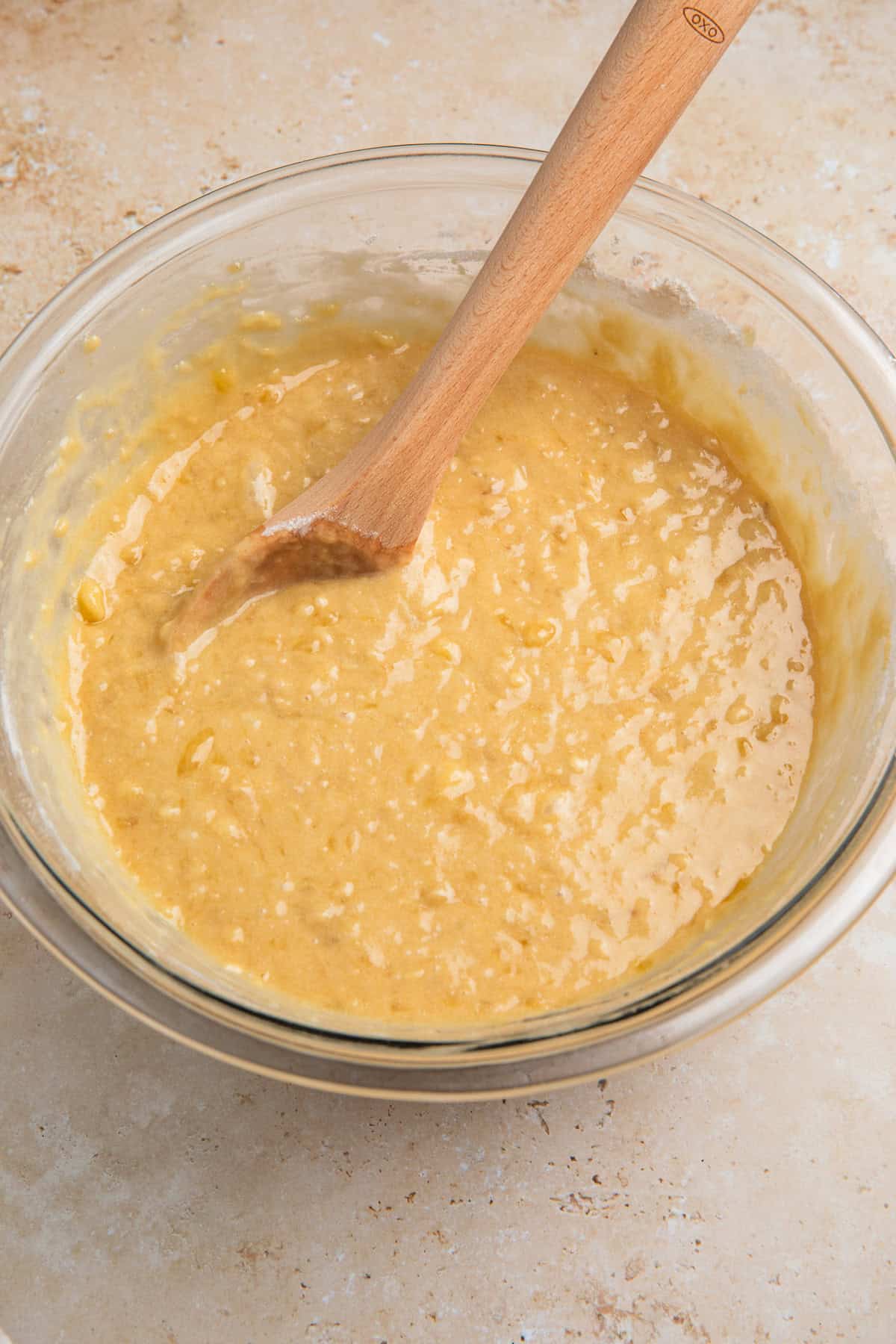 Dry ingredients added to wet ingredients in bowl.