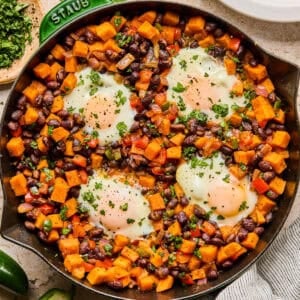 Sweet potato breakfast hash with black beans in skillet.