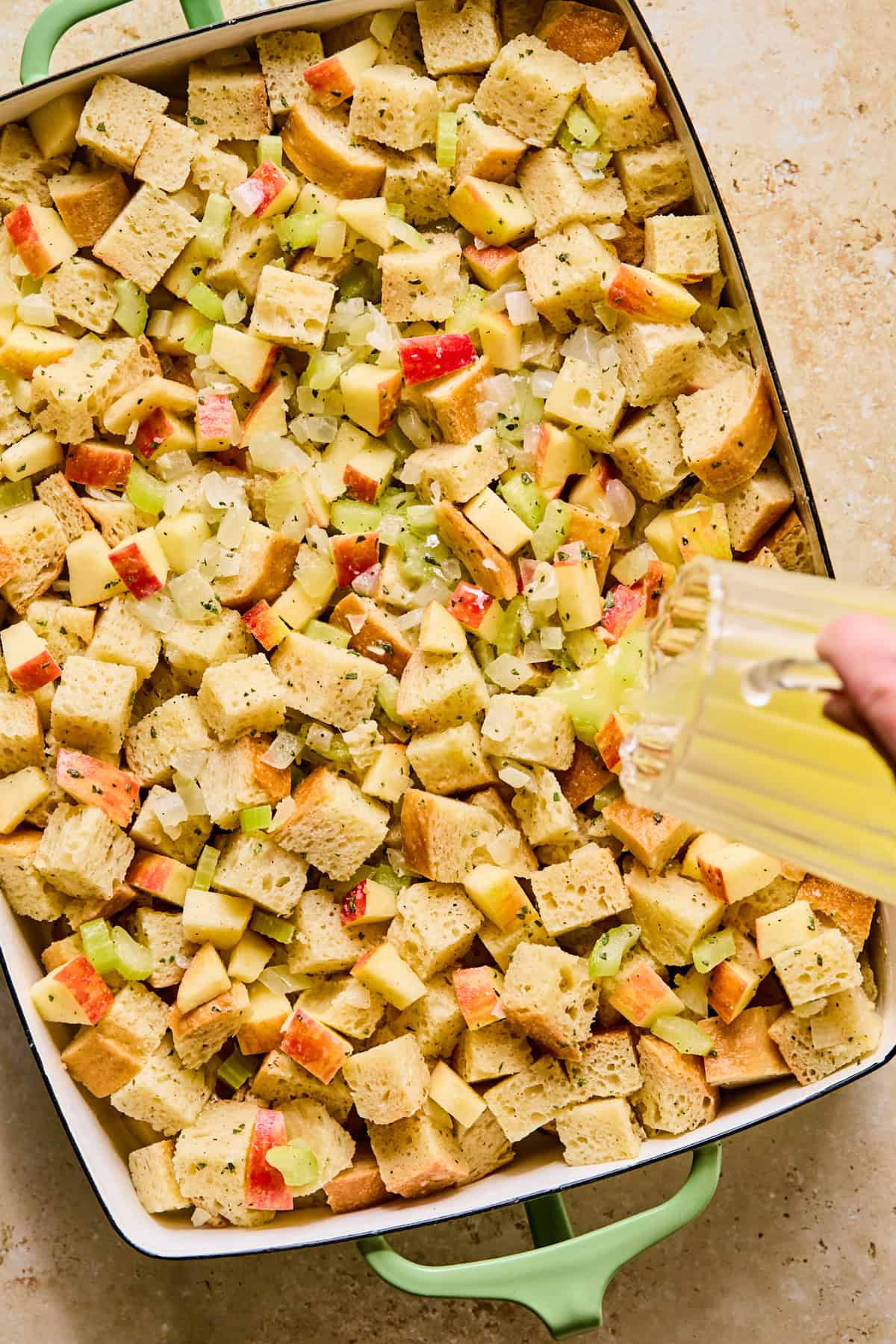 Butter poured over top of stuffing mixture in pan.