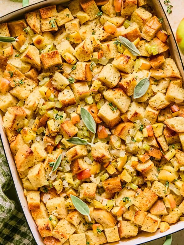 Pan with apple stuffing topped with herbs.